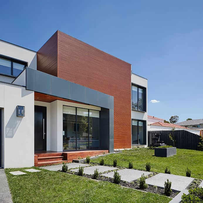 Custom paver garden pathway through landscaped garden